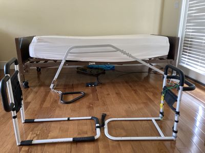 Hospital bed with side rails, mattress and trapeze bar