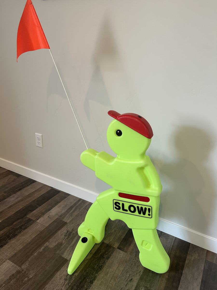 Kids at Play Safety Sign - Bright Yellow "Slow!" with Red Flag, Traffic Warning for Drivers