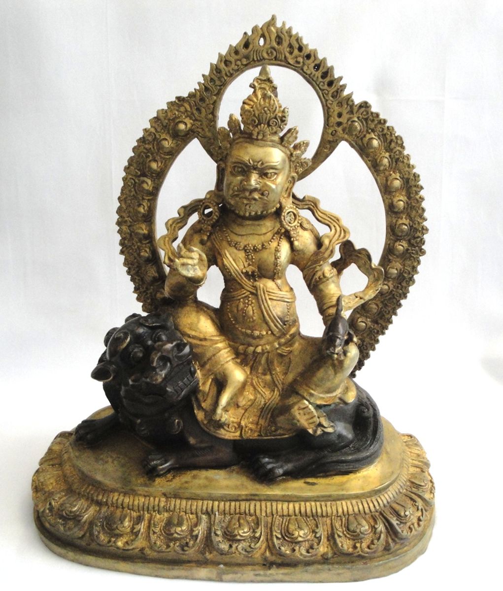 Gold-Colored Metal Statue of the Tibetan Deity Vaishravana Riding a Lion