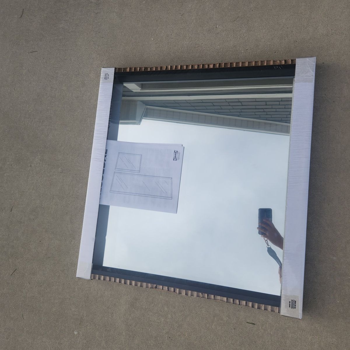 black framed square mirror