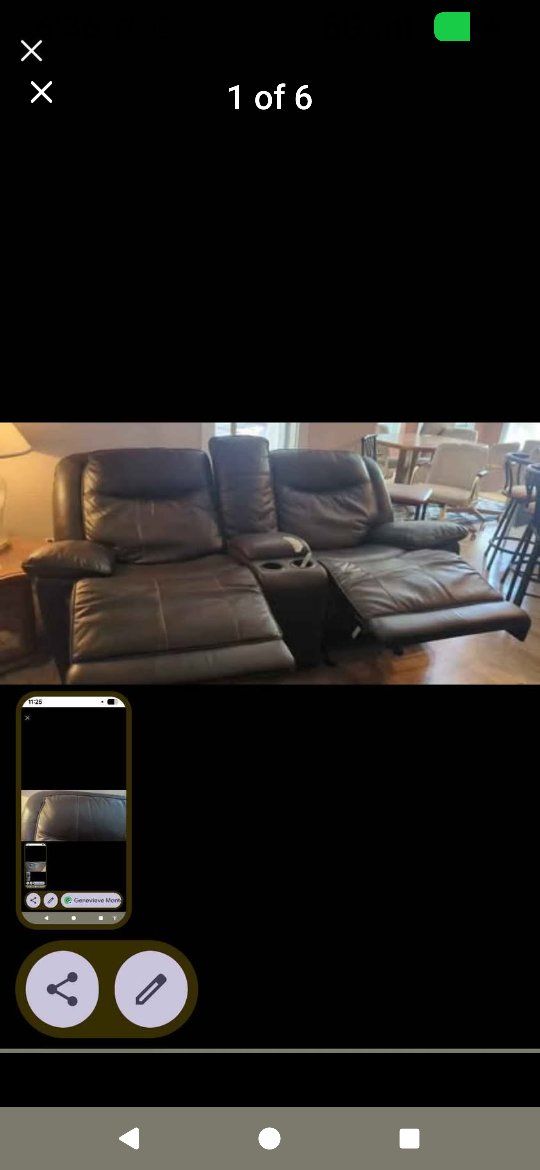 dark brown leather couch w/ reclining seats and middle storage/cupholders