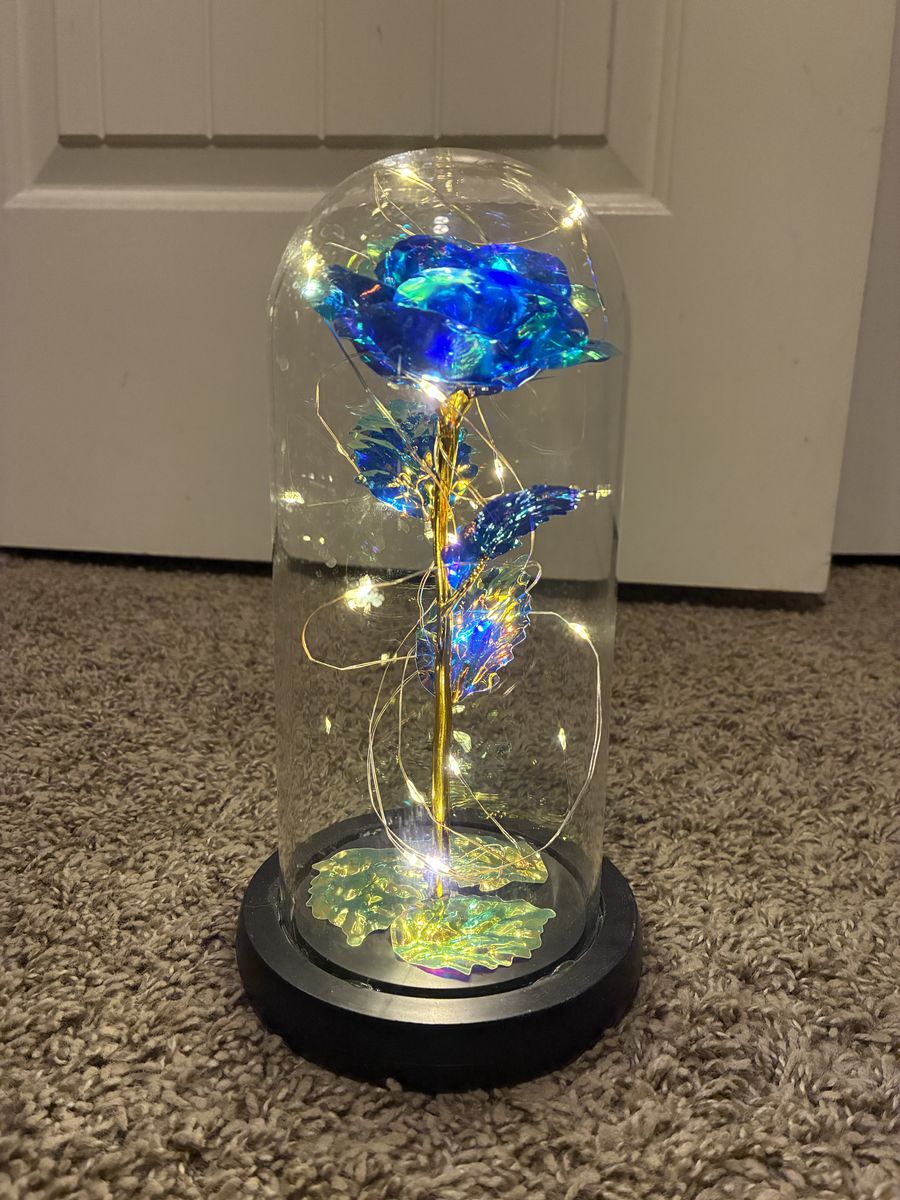 Illuminated blue and gold rose