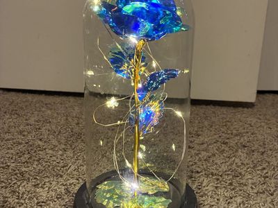 Illuminated blue and gold rose