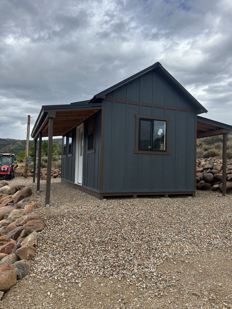 10x20 shed cabin with awnings.