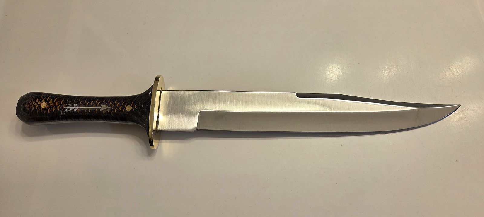 Stainless Steel Bowie with a pinecone/epoxy resin handle and brass furniture