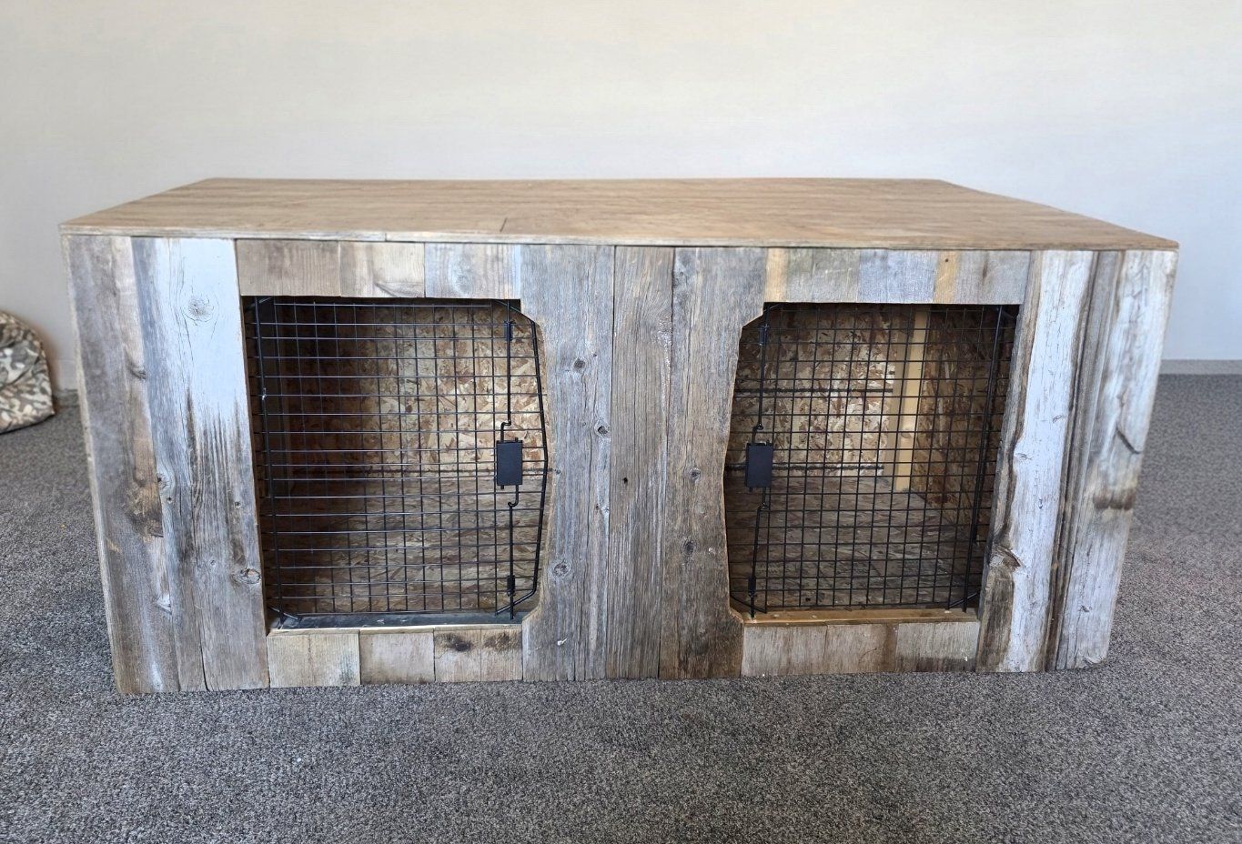 Home-made barnwood double dog kennel