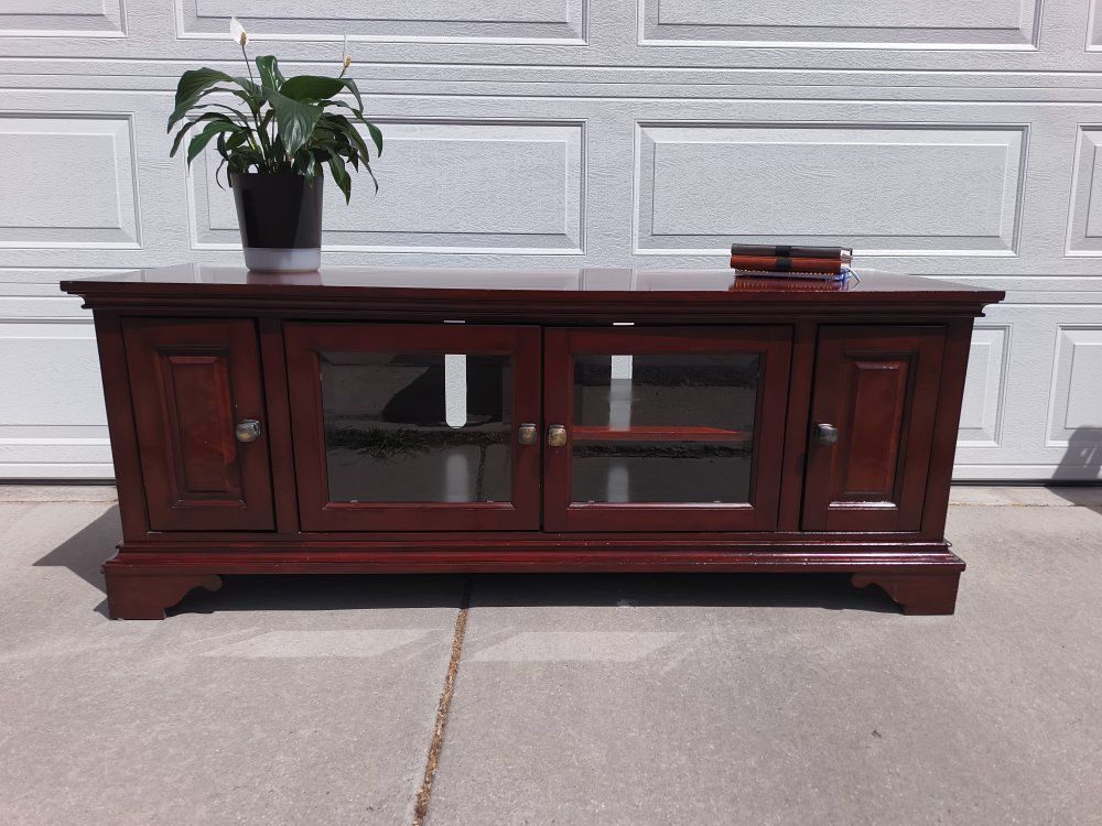 Cherry Finish Wood Entertainment Center TV Stand with Glass Doors and Storage. Delivery available