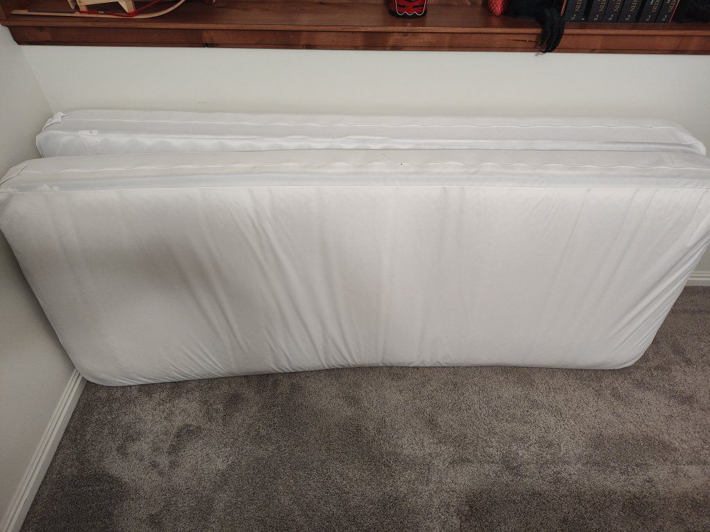Two narrow twin or cot size mattresses with extras