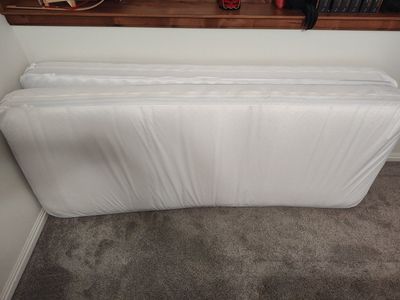 Two narrow twin or cot size mattresses with extras