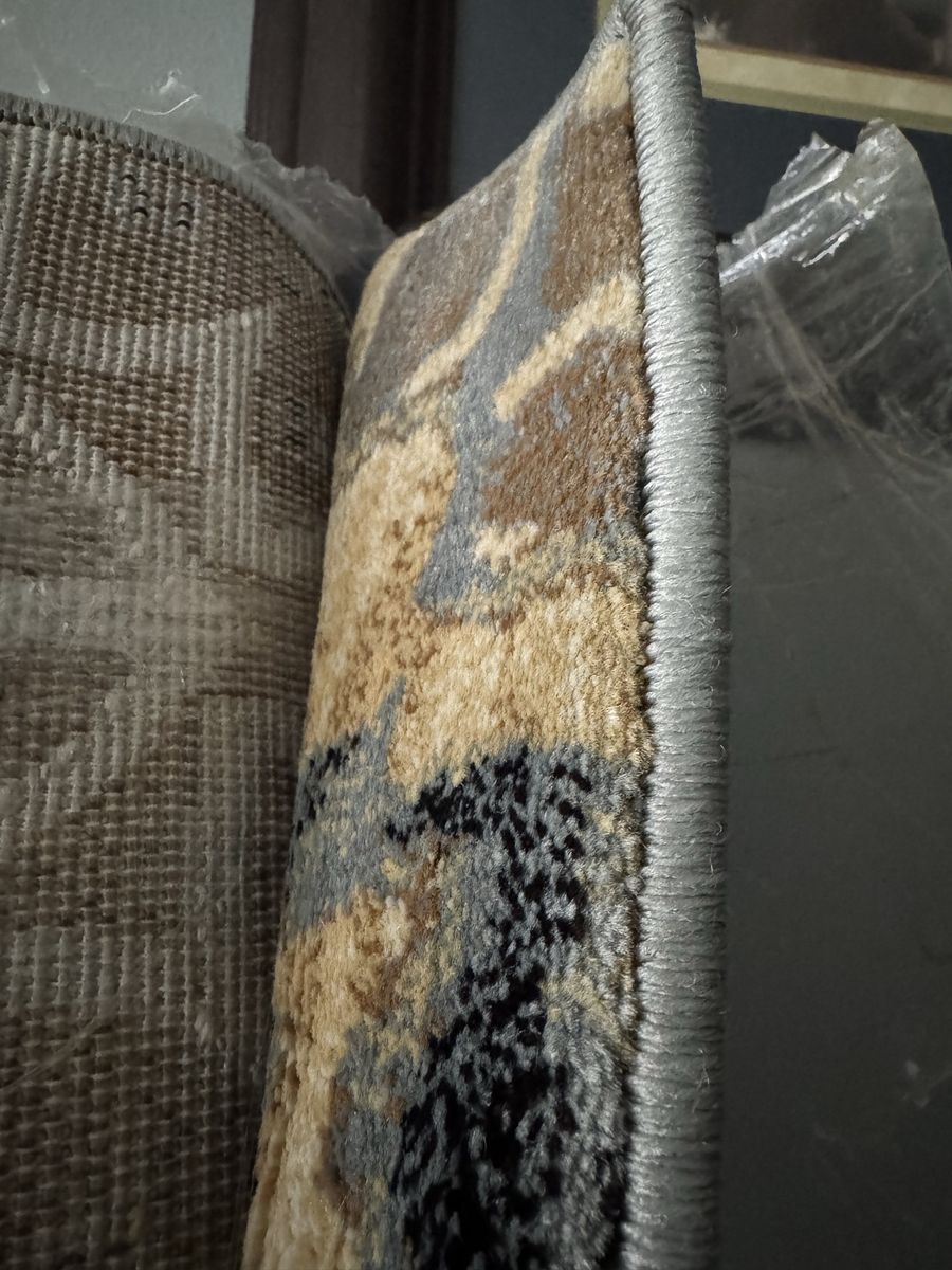 9x6ft carpet still in wrappers. Excellent quality
