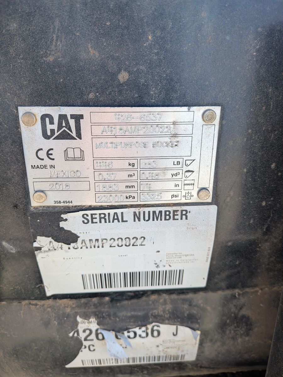 74" Cat Skid Steer Compact Track Loader 4-in-1 loader bucket. Doze, dig, grade, grab.