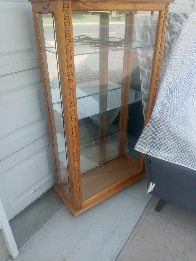 Wooden Display Cabinet with Glass Shelves and Carved Details - good Condition