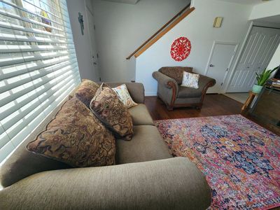 Brown and green Fabric Living Room Sofa and Armchair Set with Wooden Trim. Also has reversible cushions.