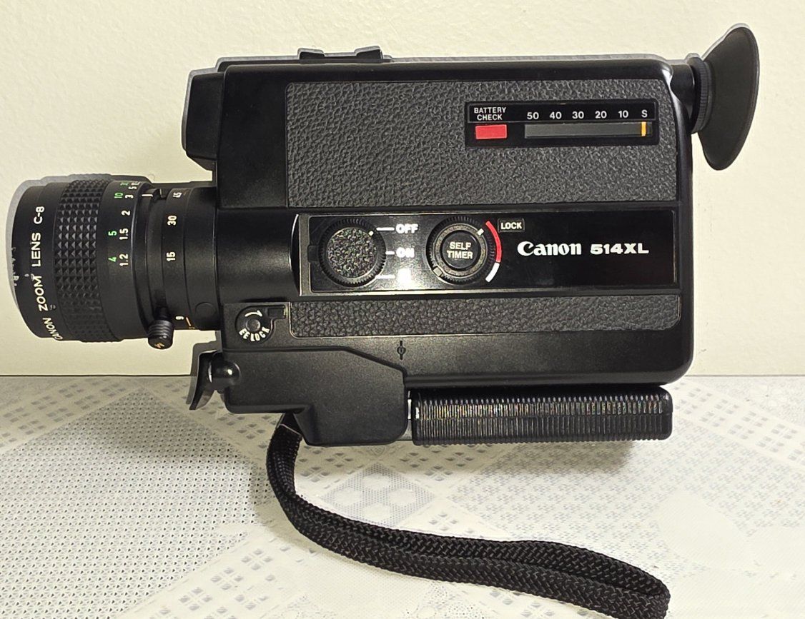 Canon 514XL Super 8 Movie Camera with 9-45mm f/1.4 Zoom Lens released on 1976.