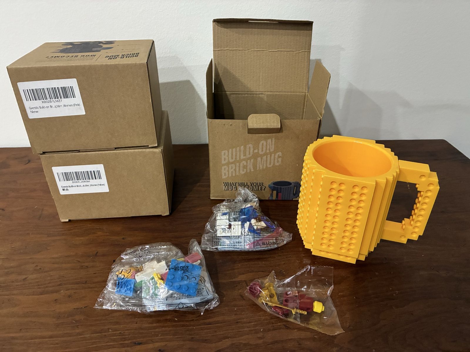 Build-On Brick Mugs 3 total - 2 yellow - 1 pink. Building Bricks and Accessories - Brand New 