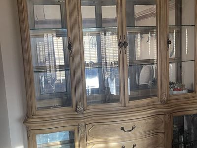 Elegant Light Wood China Cabinet & Buffet with Glass Shelves and Carved Details and matching table and 6 chairs.