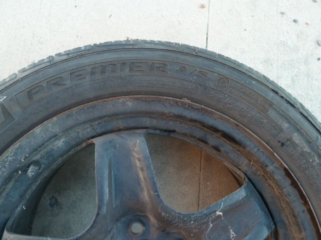 Eight 2009 OEM black Saturn Aura rims.