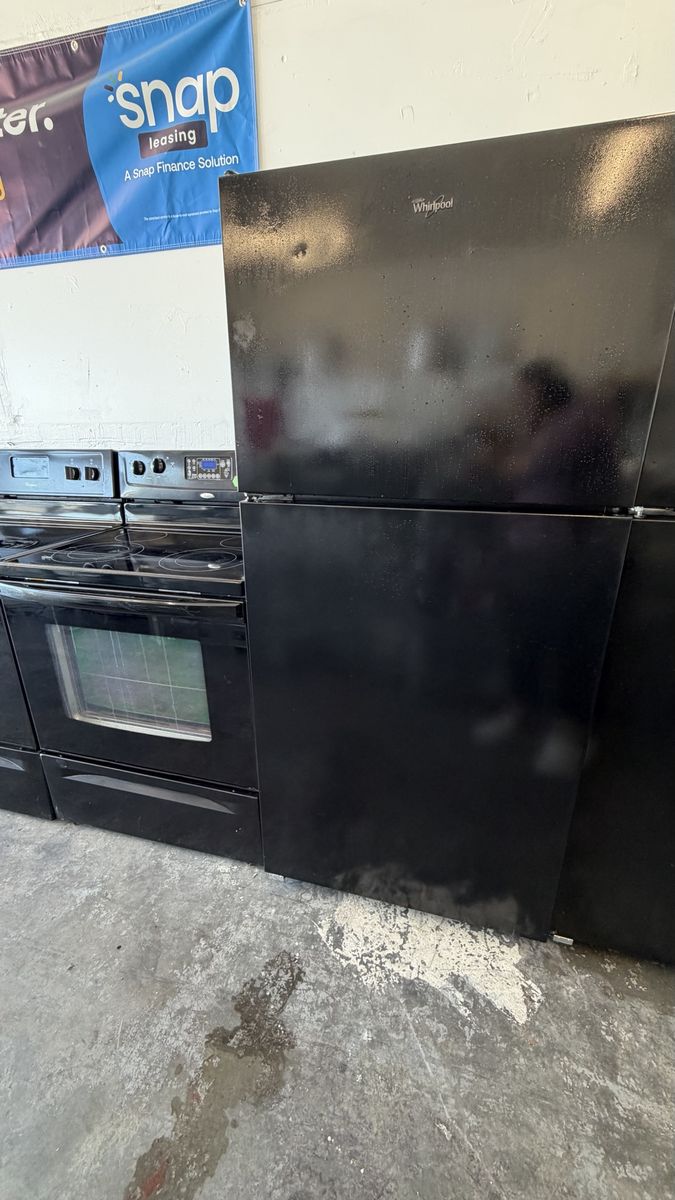 Whirlpool Black Top Freezer Refrigerator with Ice Maker (Used)