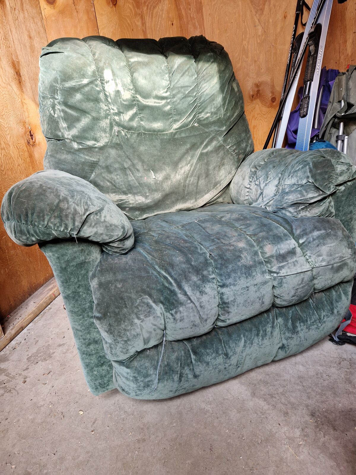 Dark green velvety reclining lazy boy