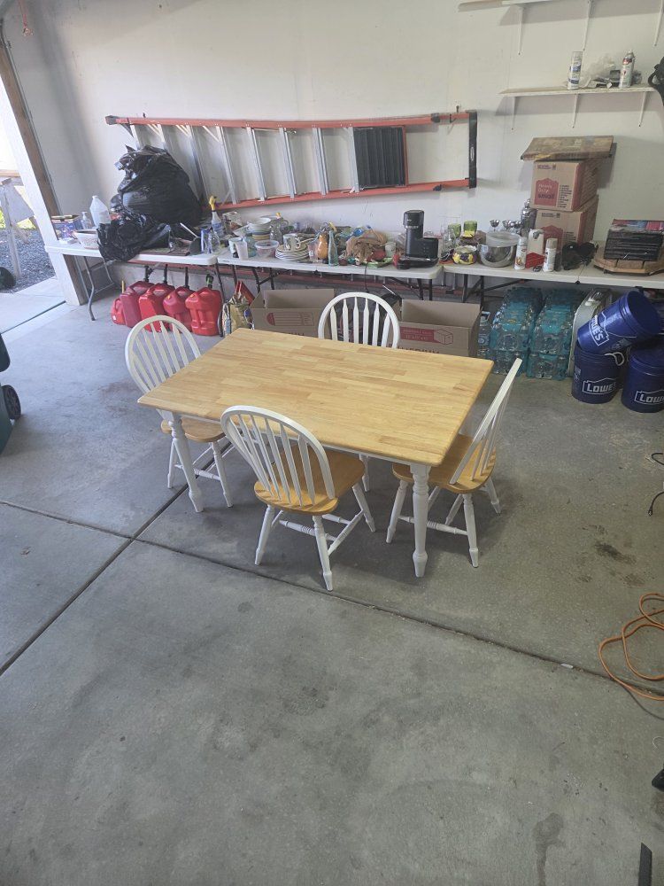 Dining table set with 4 matching chairs.