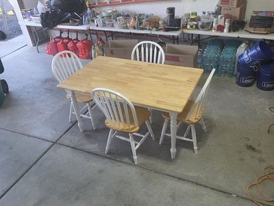 Dining table set with 4 matching chairs.