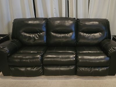 Kilzer Durablend Black Reclining Sofa. It's a little beat up, but still a great couch!