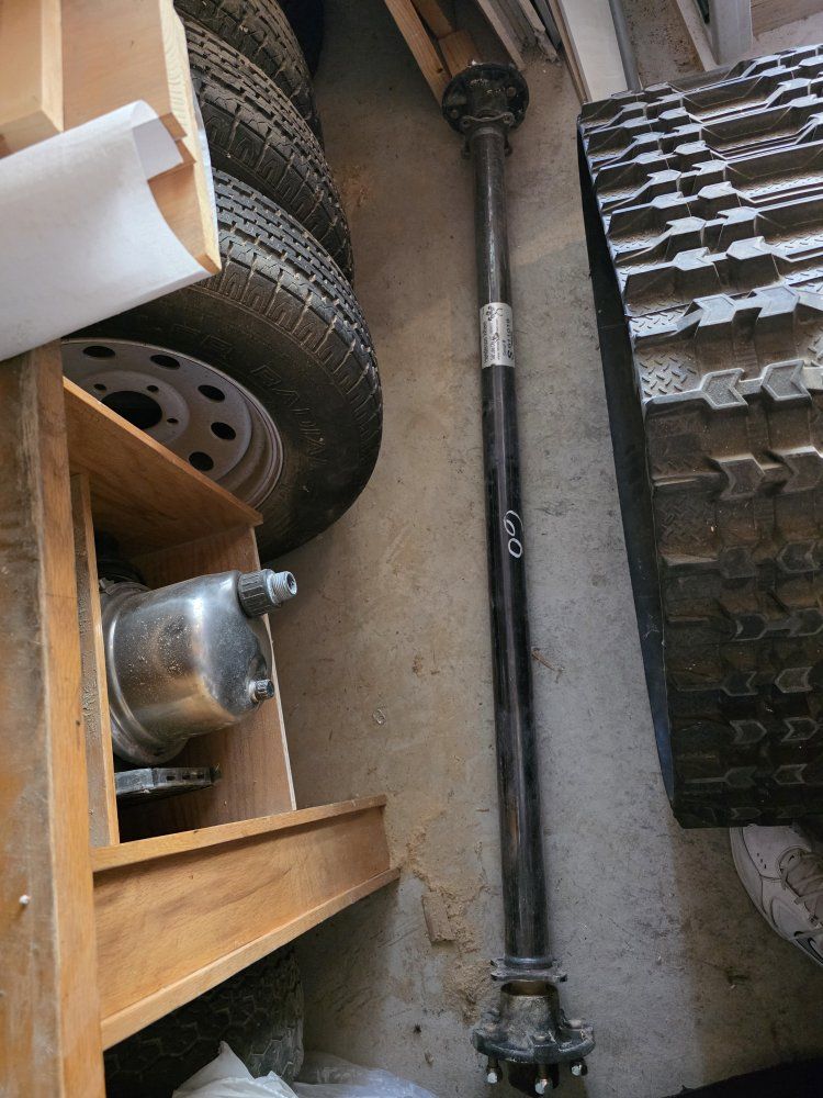 5 ft trailer axle, 3 wheels, springs, hitch