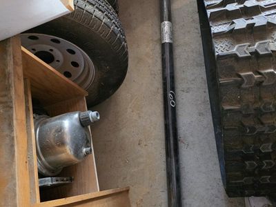 5 ft trailer axle, 3 wheels, springs, hitch