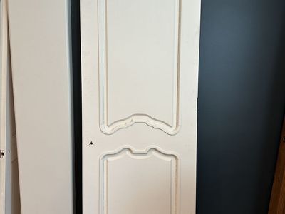 Quality solid wood interior doors removed during a remodel. These are not hollow-core or MDF—they are solid wood construction.