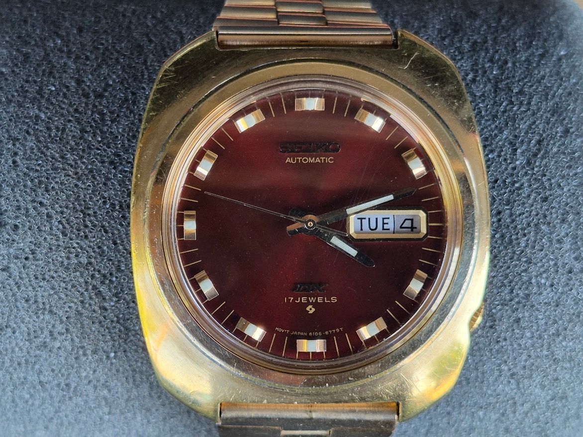 I’m selling a used vintage Seiko 6106-8439 in a tonneau shaped yellow gold-plated case