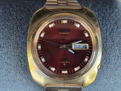 I’m selling a used vintage Seiko 6106-8439 in a tonneau shaped yellow gold-plated case