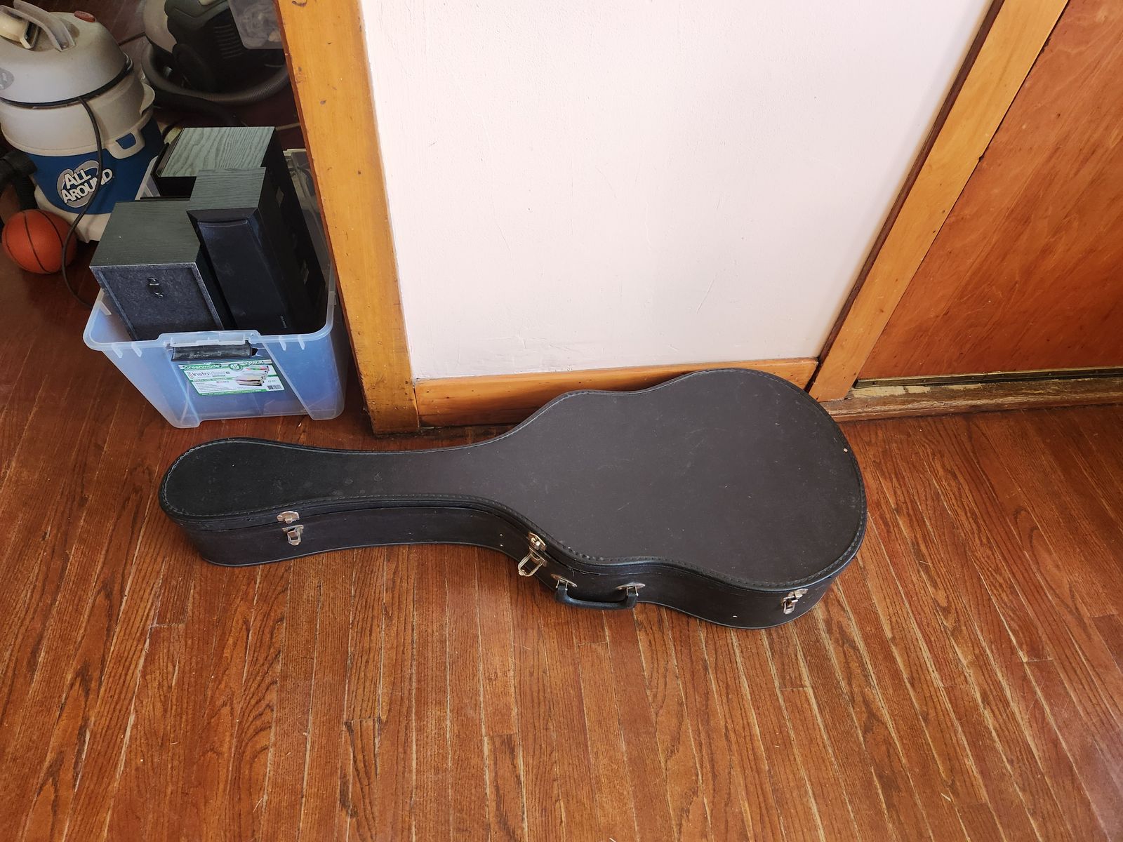 Quality hard case for an acoustic guitar.  Hardish plastic, not just cardboard.  Great shape.