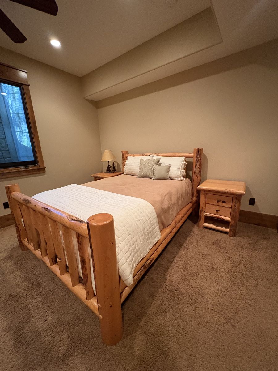 Solid wood queen bed frame with two end tables, queen mattress and box spring and bookshelf