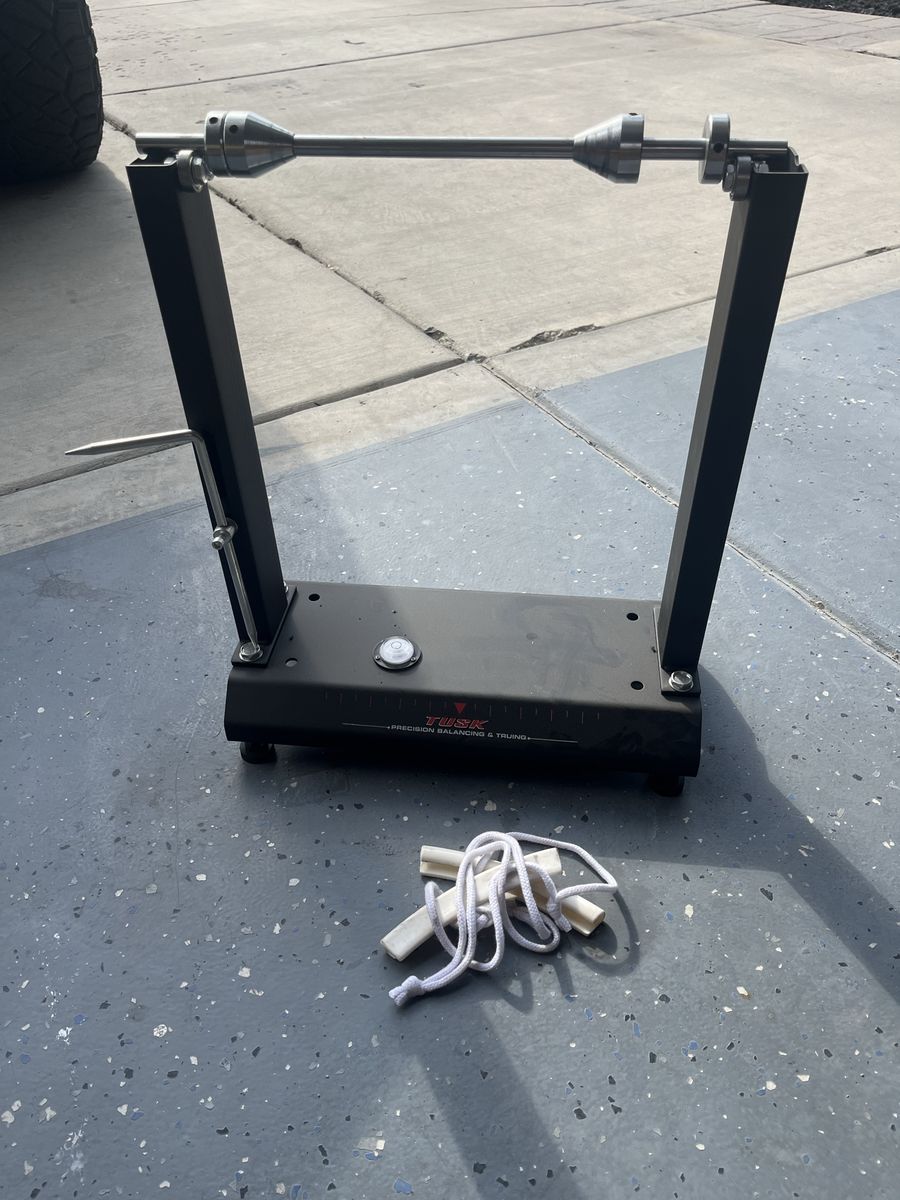 Tusk wheel balancing stand