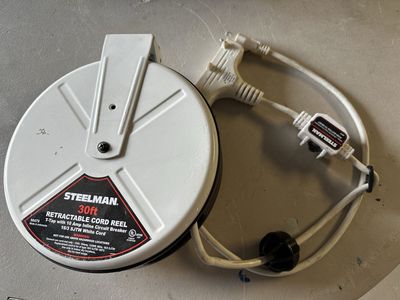 30-Foot Retractable Cord Reel with Triple Tap and 10A Inline Circuit Breaker
