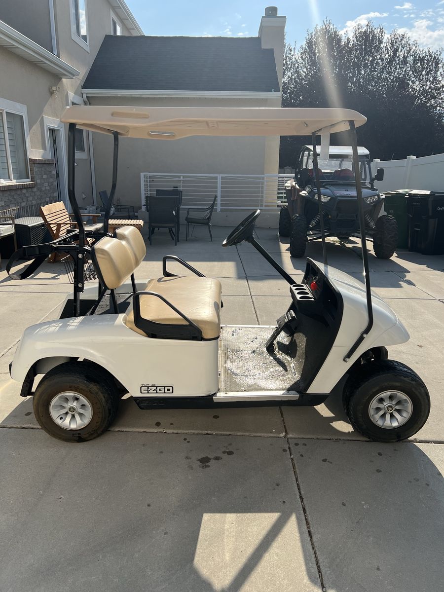 EZ GO TXT 48 Electric Golf Cart with full enclosure.
