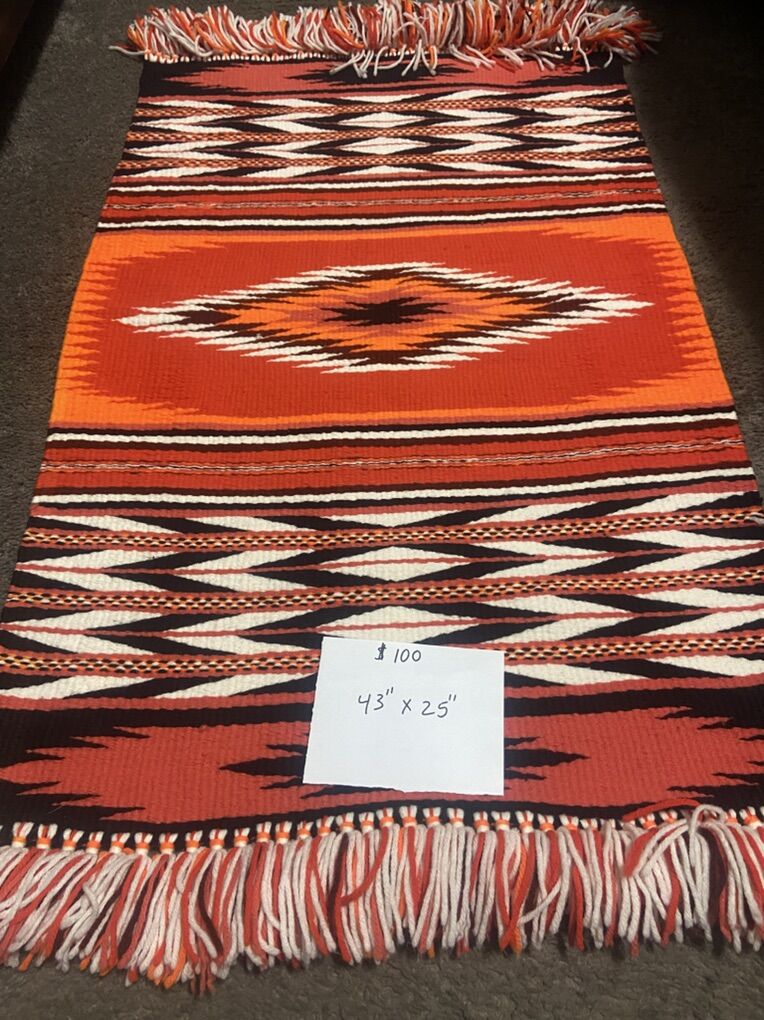 3 wool rug with a geometric design