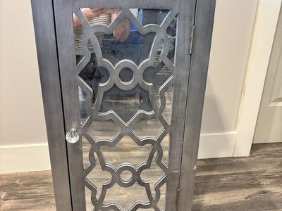 Silver Accent Cabinet with Mirrored Cutout Door and Interior Shelf
