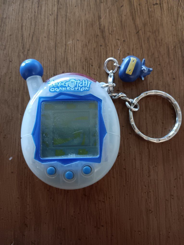 Tamagotchi Connection V4 – Translucent Blue/White with Original Gozarutchi Ninja Charm