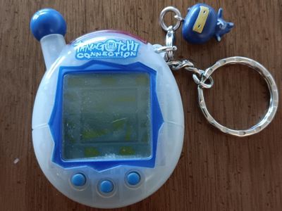 Tamagotchi Connection V4 – Translucent Blue/White with Original Gozarutchi Ninja Charm