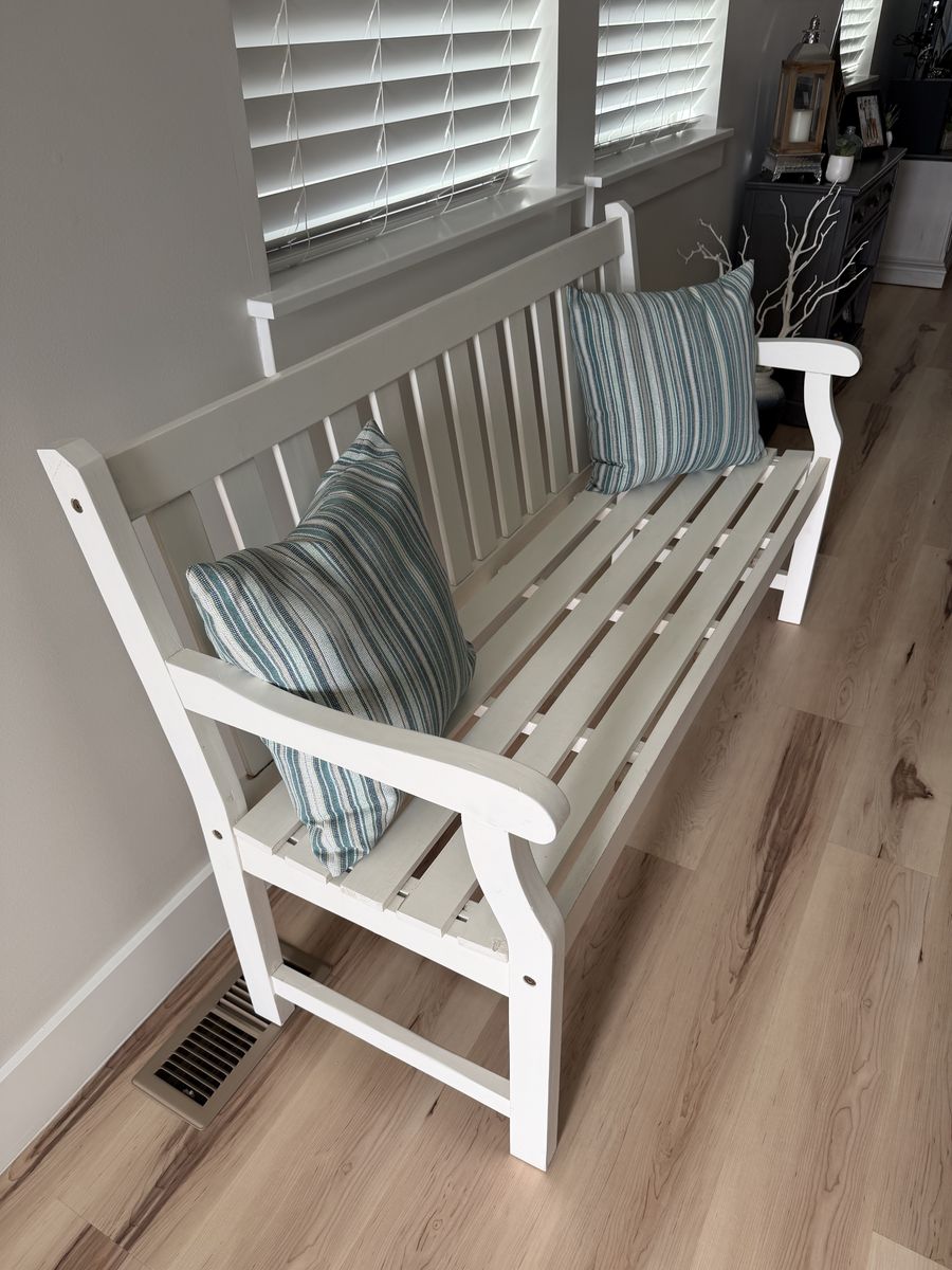 White painted bench with pillows