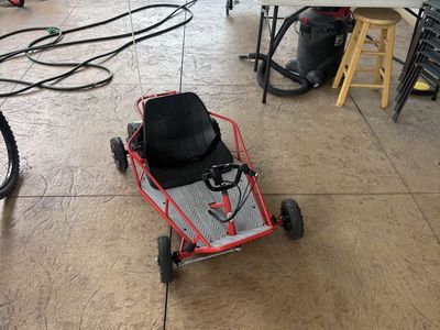 Razor 24 volt go cart. New batteries runs great. Includes marker flag