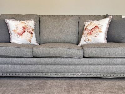 Stylish Gray Fabric Sofa with Nailhead Trim & Decorative Pillows