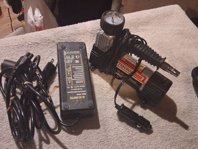 Pittsburgh 12V 100 PSI High-Volume Air Inflator paired with a separate aftermarket 120V AC to 12V DC power adapter converter