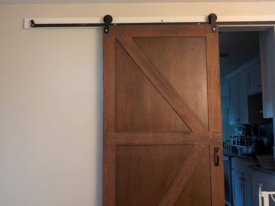 Rustic Wood Z-Brace Sliding Barn Door with Black Hardware