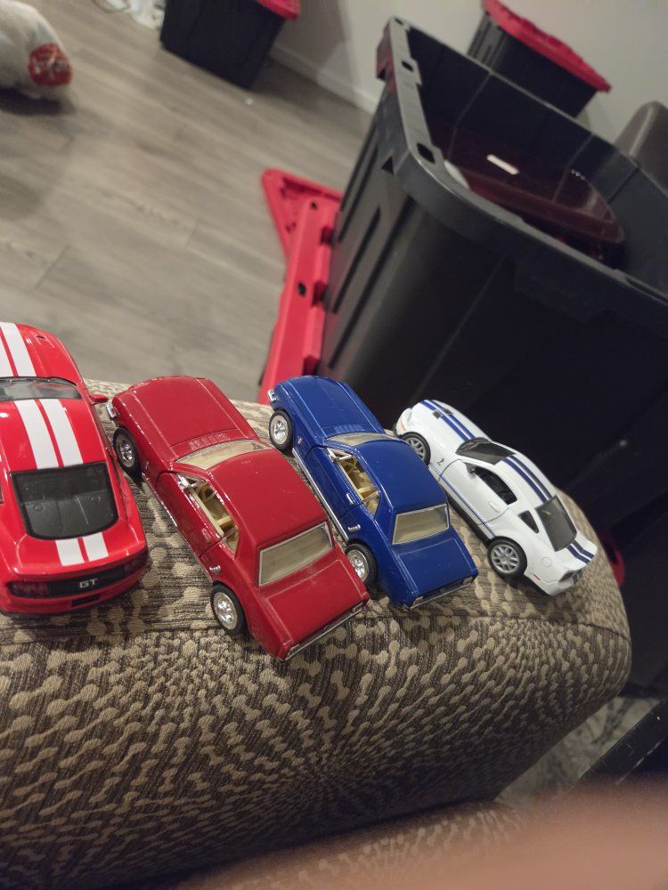 Lot of 4 Assorted Die-cast Toy Cars - Red GT, Red Classic Car, Blue Classic Car, White Sports Car