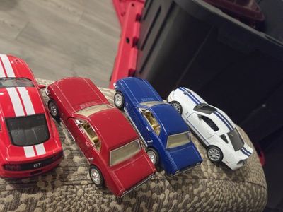Lot of 4 Assorted Die-cast Toy Cars - Red GT, Red Classic Car, Blue Classic Car, White Sports Car