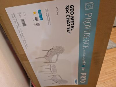 White table and two chairs