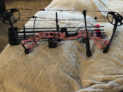 Brand New Compound bow and 5 arrows plus wrist release.