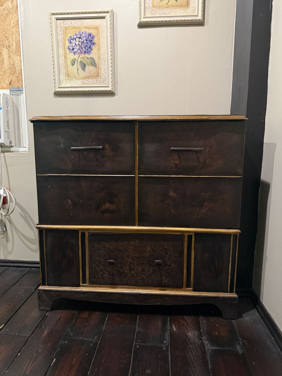 Dark Wood Cabinet with Gold Accents